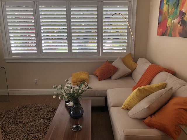 Another view of the Den overlooking the completely private lush garden and pool. The Den also includes a coffee table that can be converted into a dining or work table