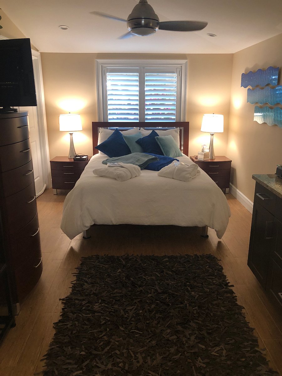 View of the bedroom/kichenette area located at the west end of the building and is shaded from the trees in the front yard to enable you to sleep in if you wish to . The room has its own climate control, including an overhead fan for optimal comfort