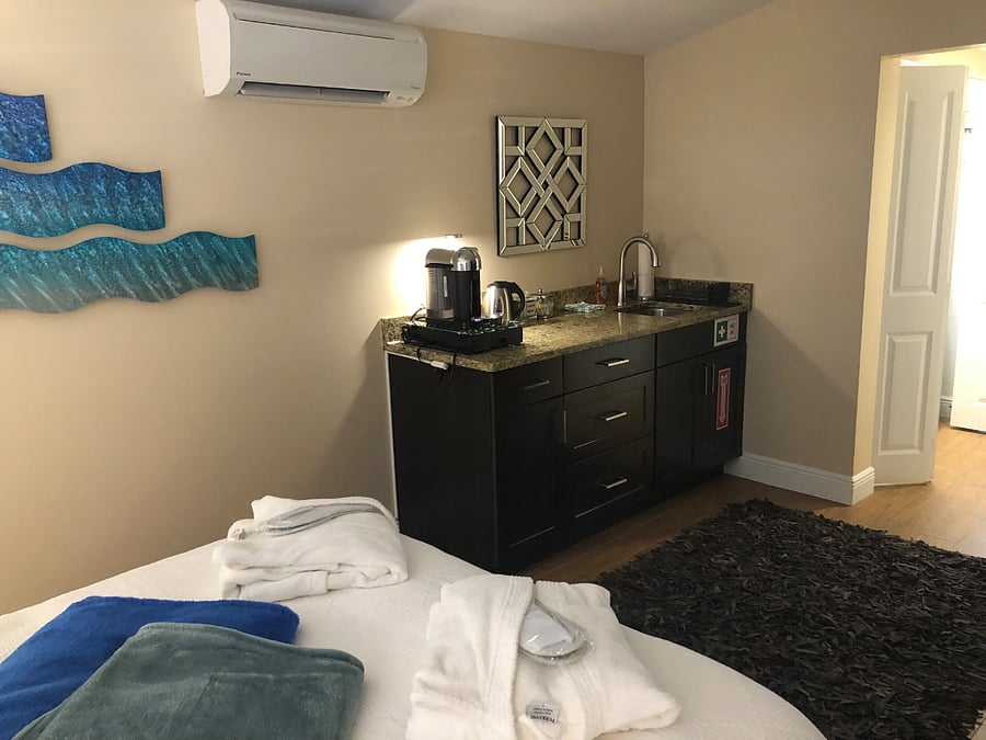 The room includes a Nespresso machine with coffee capsules as well as a hot water kettle and various teas for the tea drinkers. The kitchenette includes all the basics needed to cook simple meals or possibly go beyond for the more ambitious.