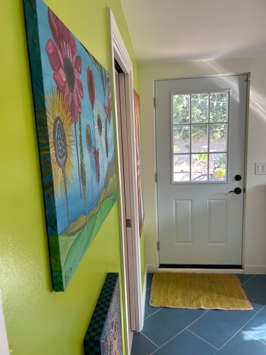 The private entrance door with windows and double locks adds light and privacy.