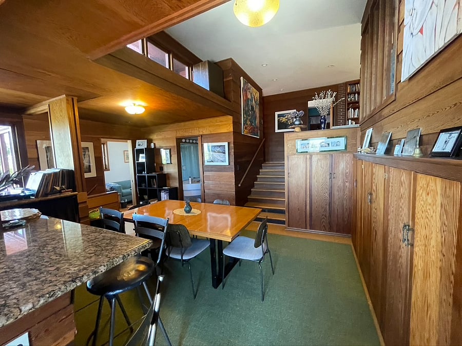 first floor dining area looking up to second floor