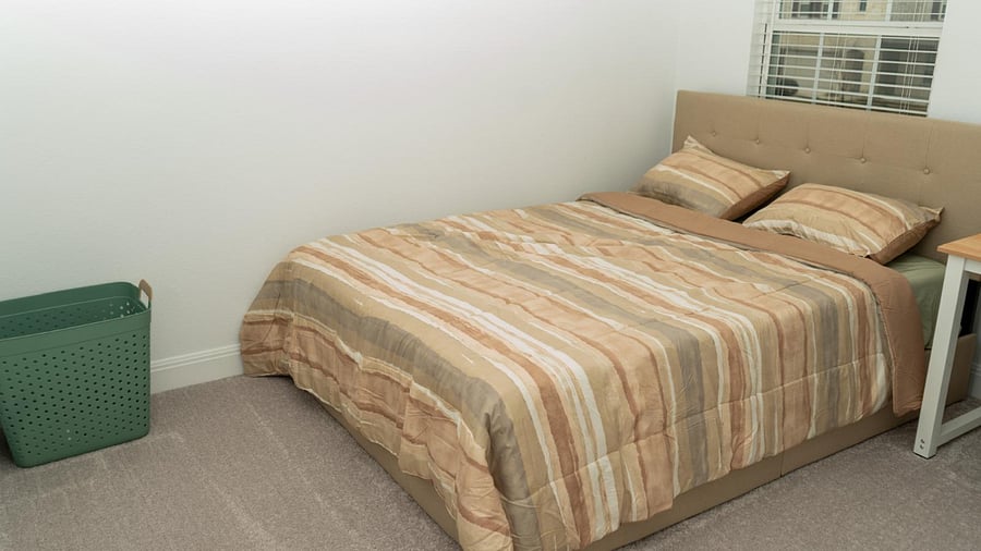 Bedroom 2- bed and laundry basket