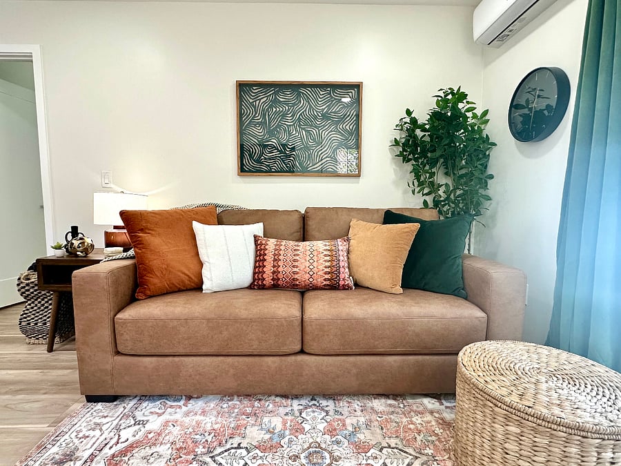 Living room queen sleeper sofa bed for guests (seat opens forward, back of the couch comes down, cushions can be put back in place or left off). Full set of sheets, comforter+cover and pillows are ready in the unit.