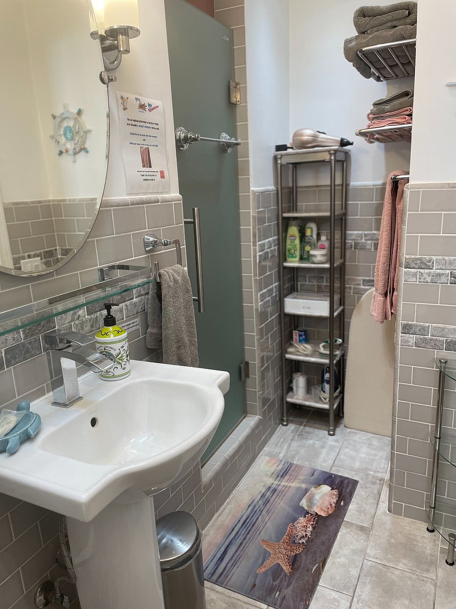 Fully equipped bathroom and glass shower door