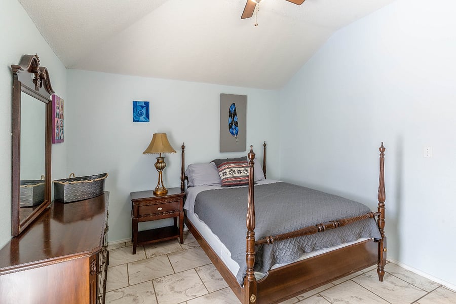 2 of 4 Bedrooms:  Queen Bed, and view of pool area.