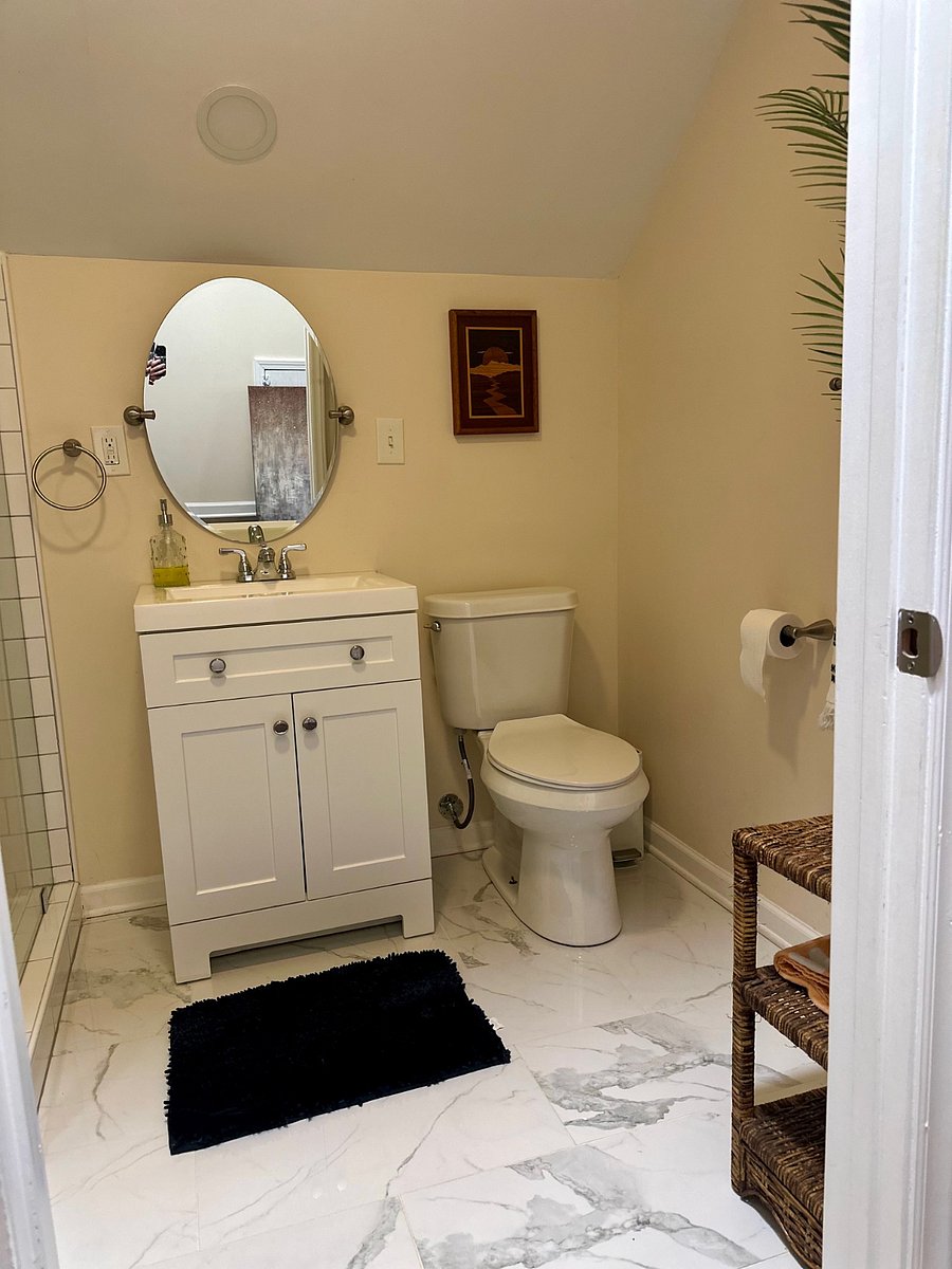 Your own private full bathroom, featuring a modern shower and all the essentials for your convenience.