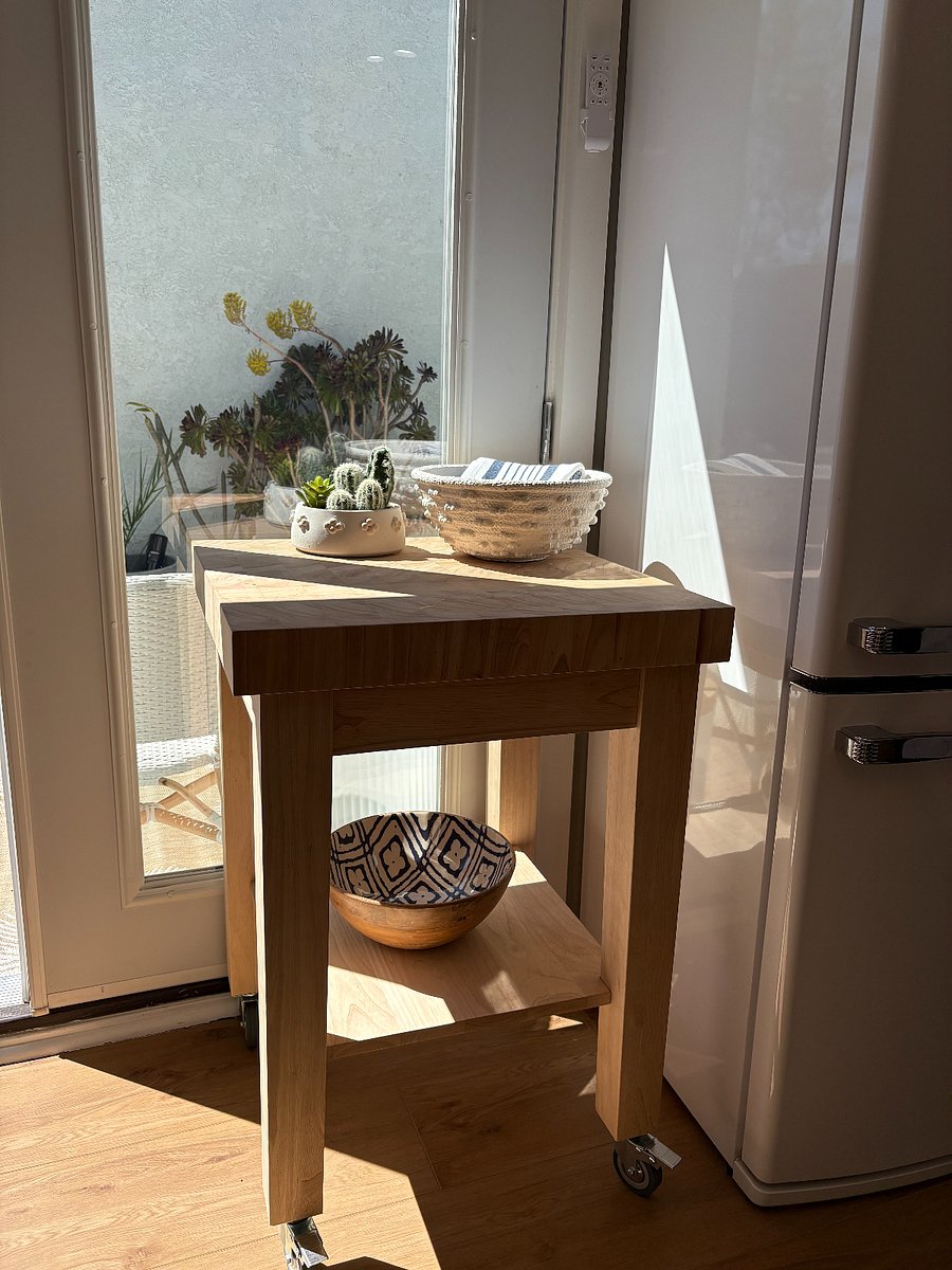 one (1) of two 24-inch rolling carts with cutting board surface