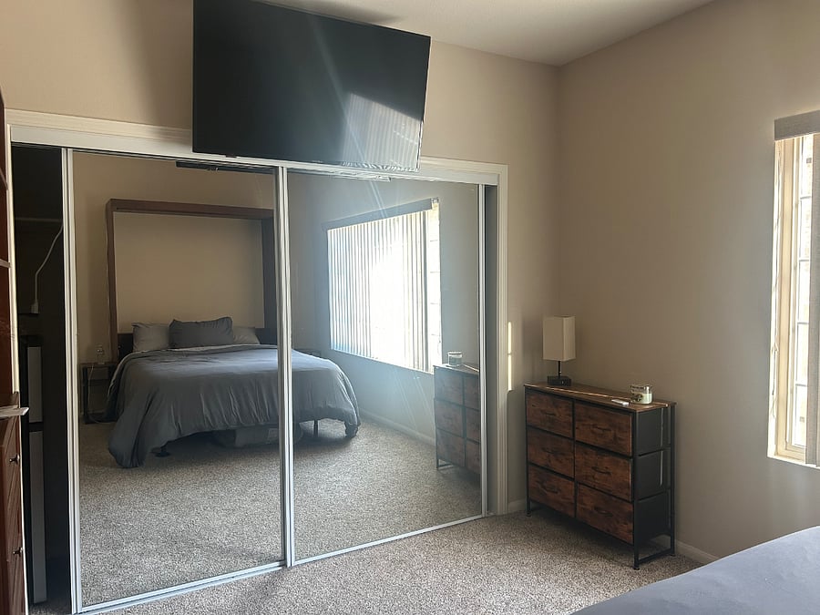 Bedroom with large closet and storage