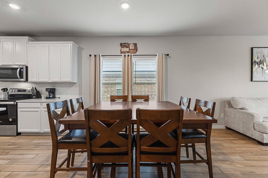 Wooden dining table with 8 chairs