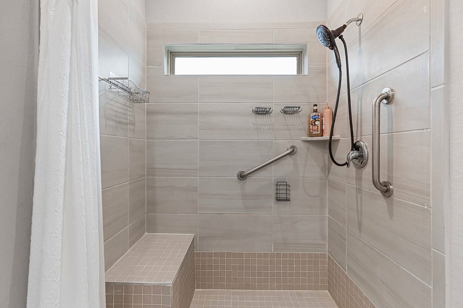 Standing shower in the primary bedroom ensuite bathroom