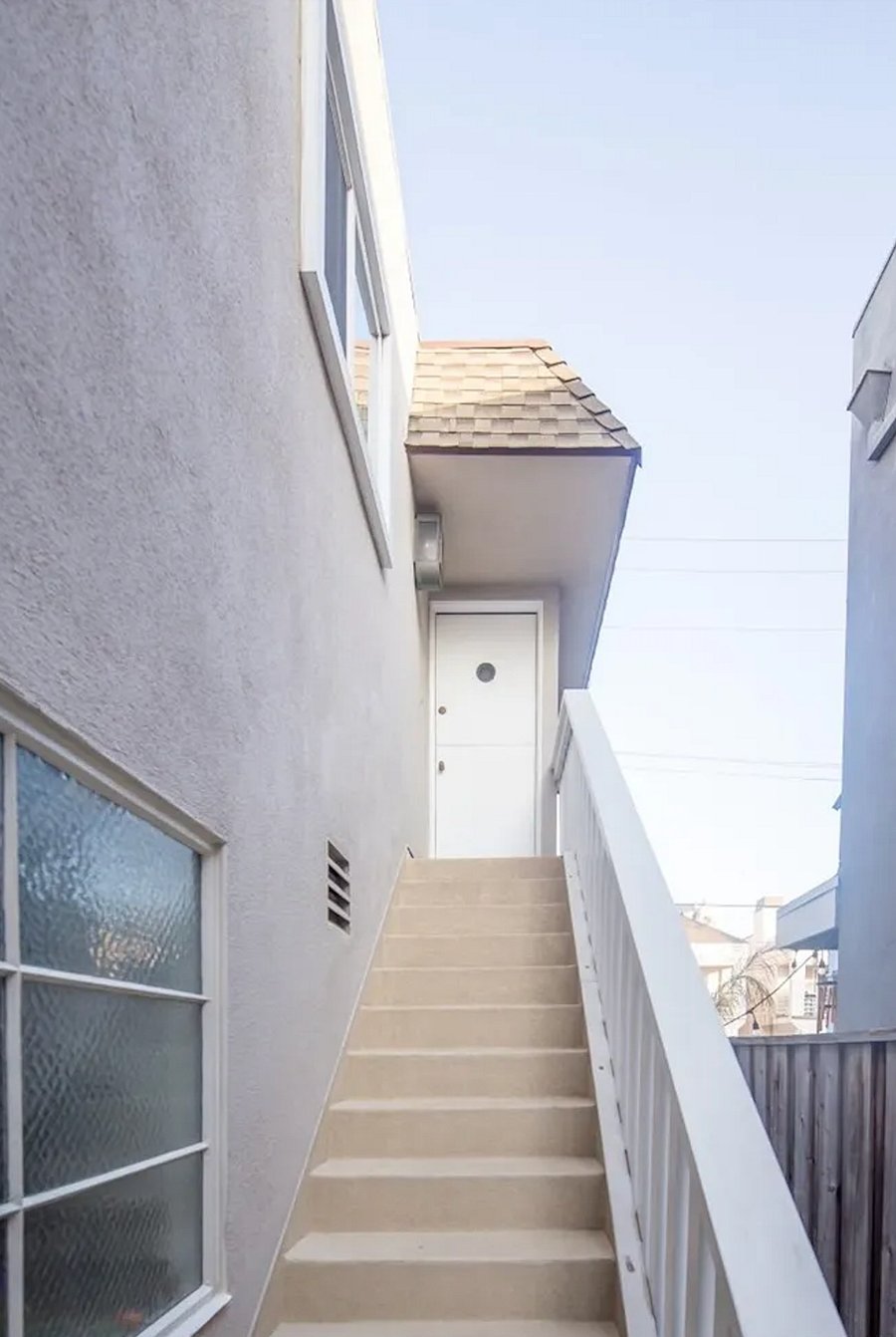 Private stairs to unit, with dutch door