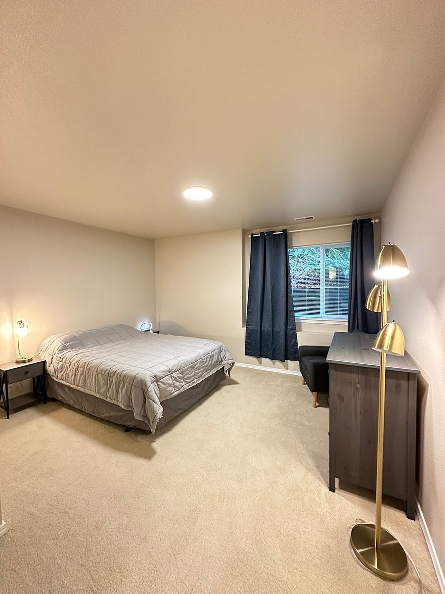 large sized bedroom with blackout curtains for nightshifters