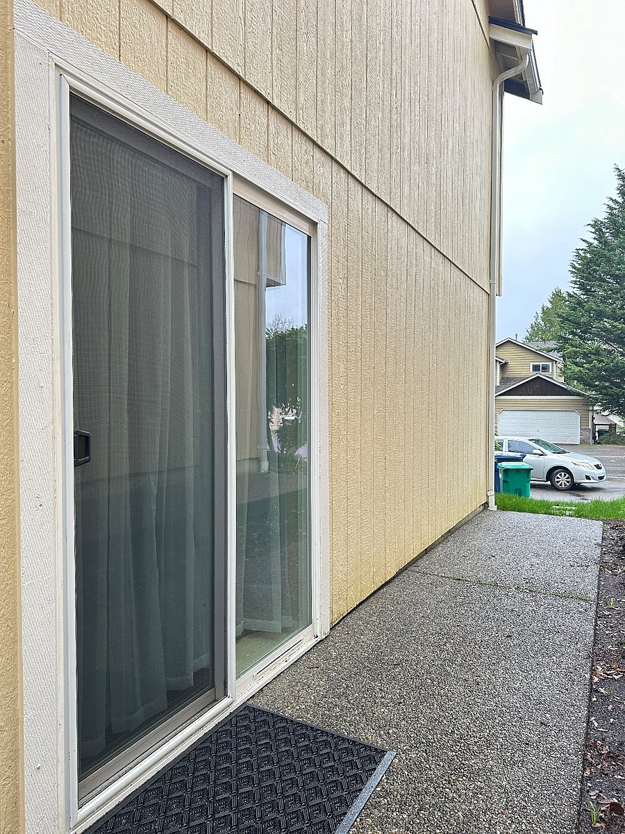 your private entrance with a pathway leading to parking spot right in front 