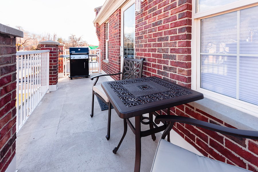 Private balcony with seating and grill