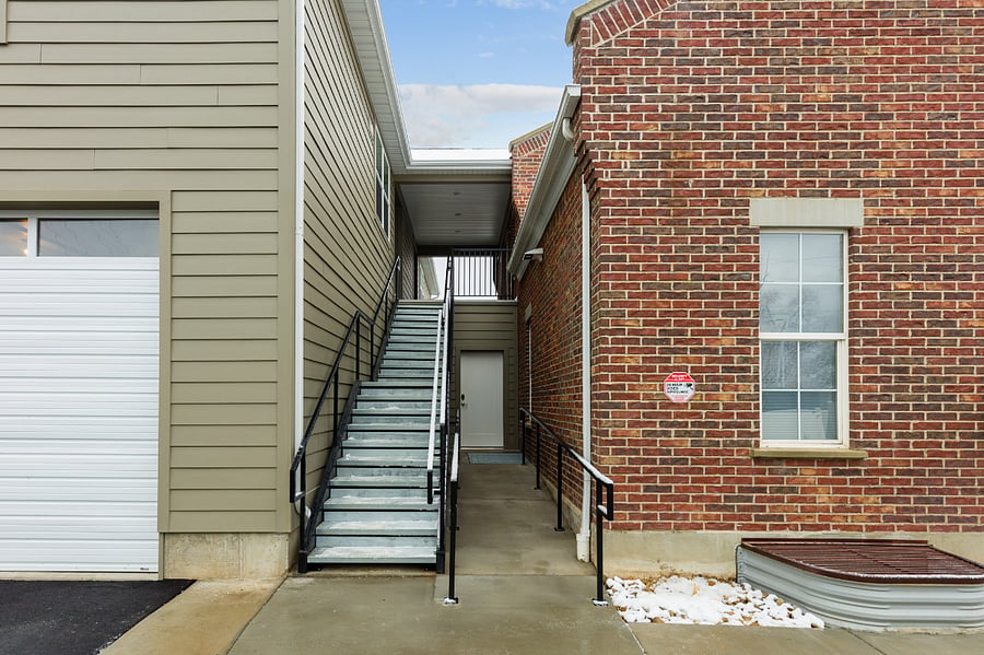 Exterior stairs to upper level with Unit 5
