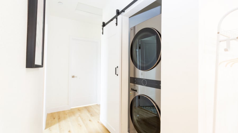 Brand new washer and dryer hidden in stylish barn door. 