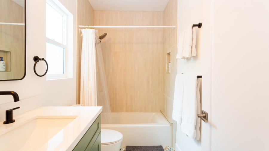 Master bathoom with beautiful tile and fixure. 
