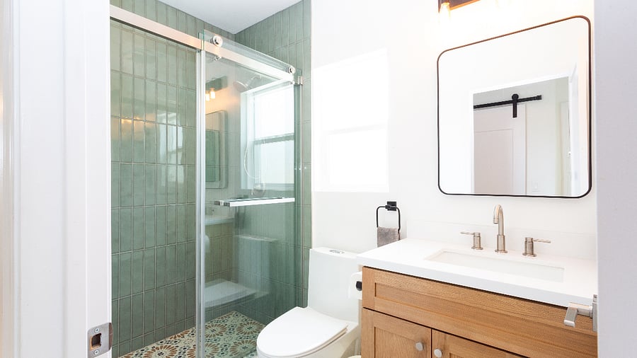 Guest bathroom with beautiful tile and fixture.
