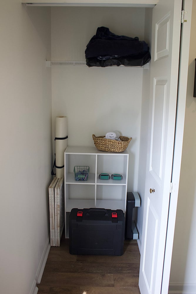 Closet with provided work out supplies (yoga mat, resistance bands, adjustable weight set)
