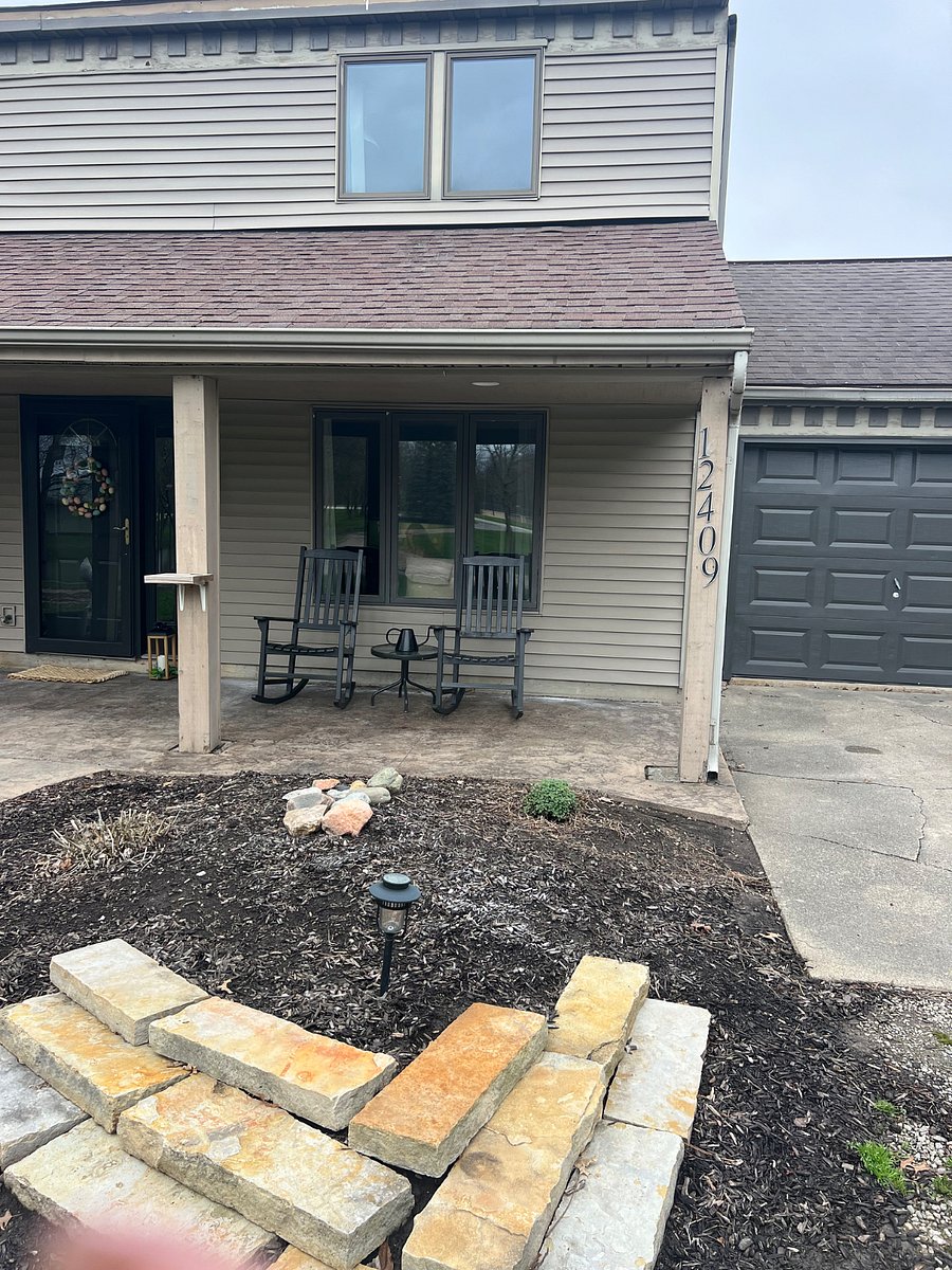 Front porch with rockers and stamped concrete