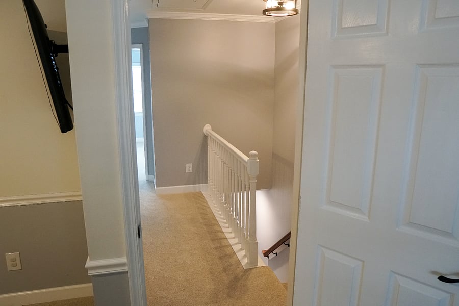 upstairs hallway looking away from primary bedroom on 2nd floor, new carpet in hallway