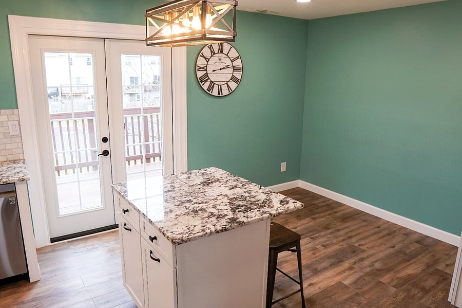newly renovated kitchen with all new flooring, cabinets, countertops, lighting, and appliances