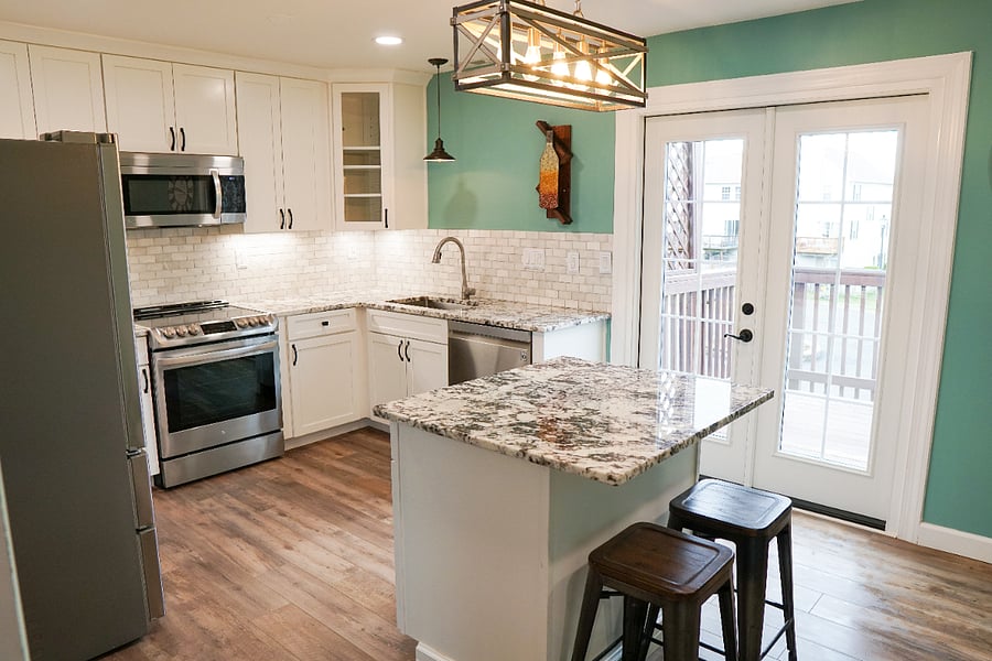 newly renovated kitchen with all new flooring, cabinets, countertops, lighting, and appliances