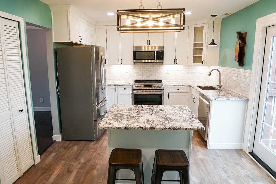 newly renovated kitchen with all new flooring, cabinets, countertops, lighting, and appliances