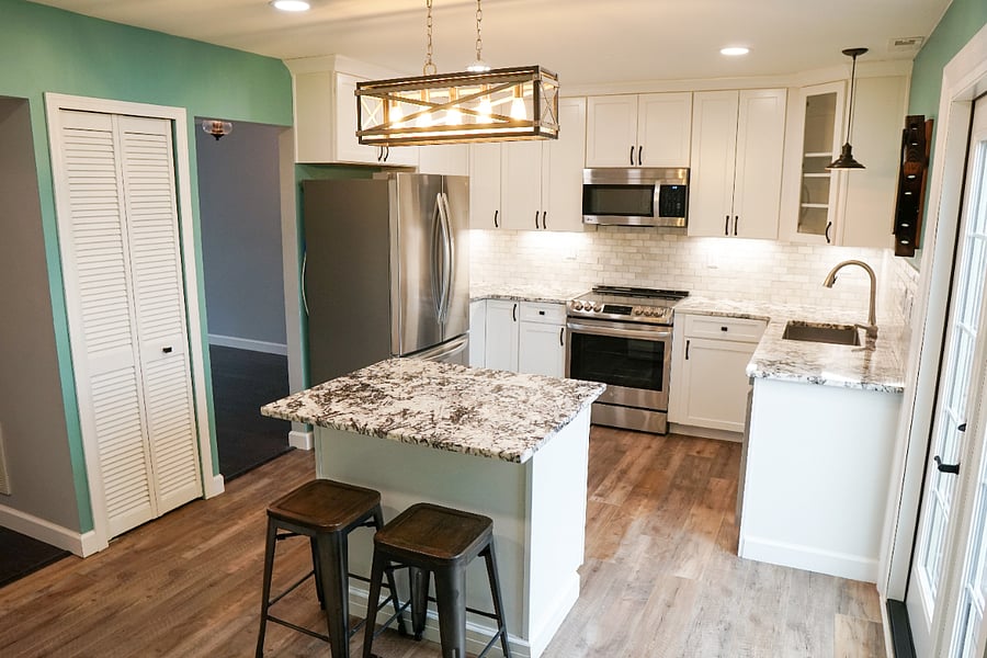 newly renovated kitchen with all new flooring, cabinets, countertops, lighting, and appliances