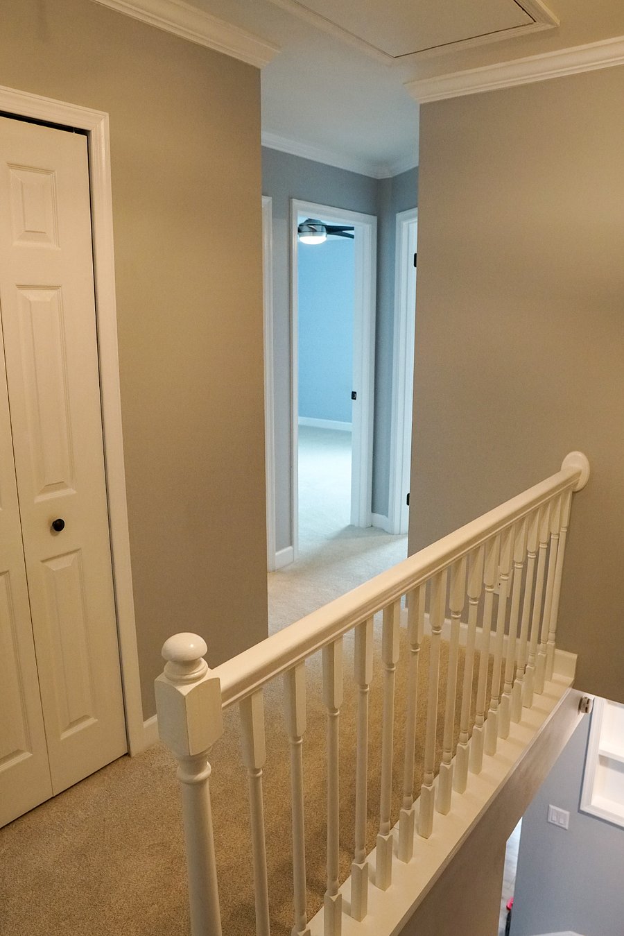 upstairs hallway looking at one of the spare bedrooms on the 2nd floor from the top of the staircase