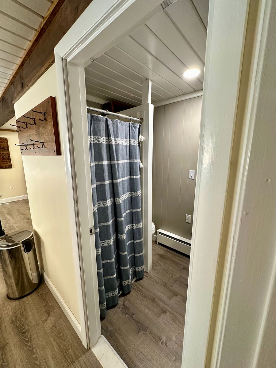 Bathroom shower includes detachable spray head.