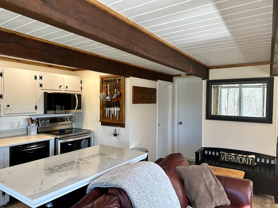 The door to the right of the bathroom can be locked and leads to a shared laundry room.