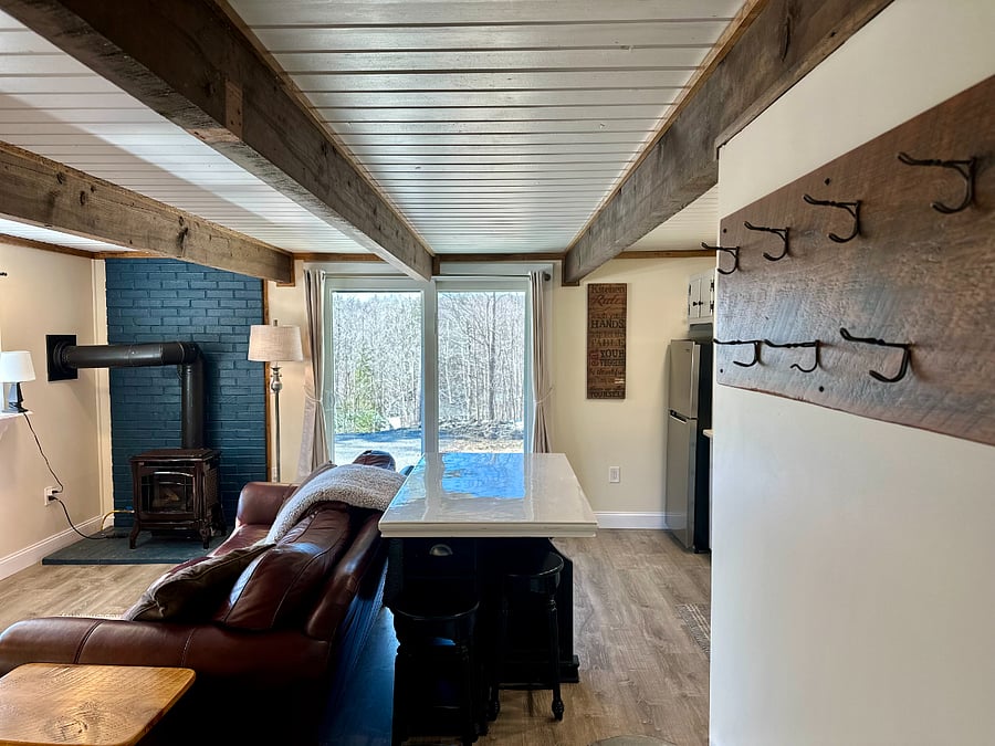 Living area includes gas stove with thermostat setting