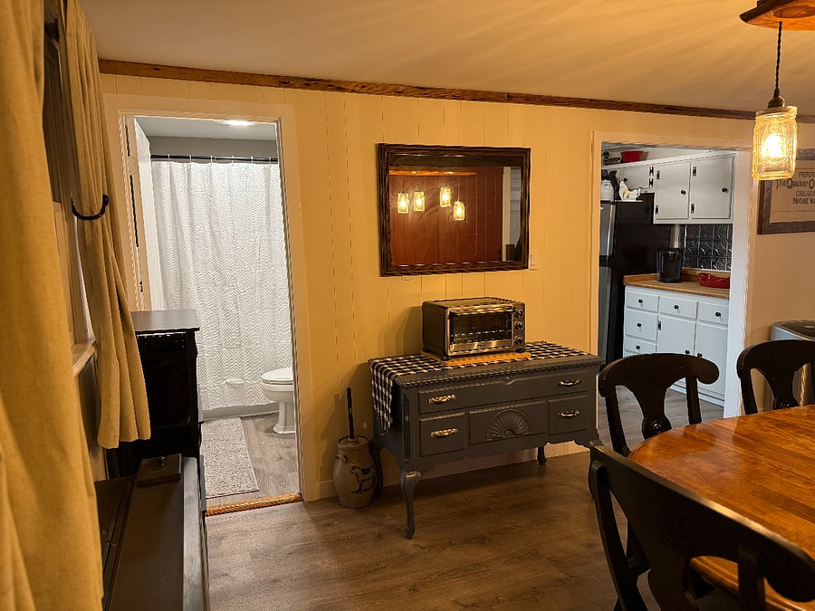 Dining Room looking into Kitchen on right side and bathroom on left side