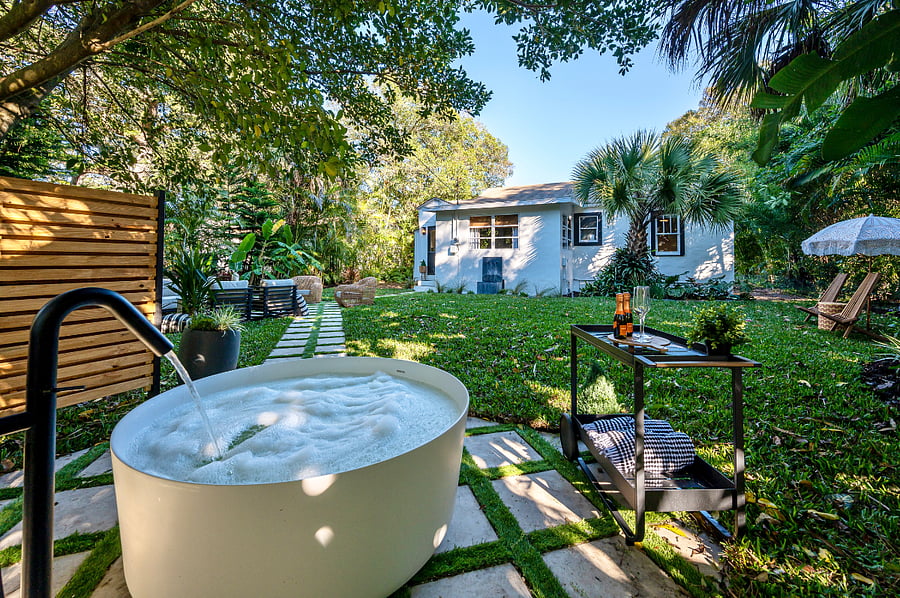Soak under the stars. This outdoor bathtub with a tankless water heater offers the perfect blend of relaxation and luxury. Enjoy a hot bath surrounded by nature.