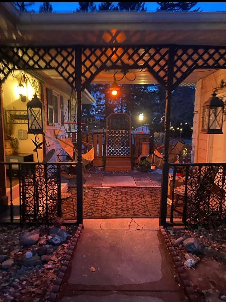 Breezeway for relaxing on swings, and entrance to the front door.