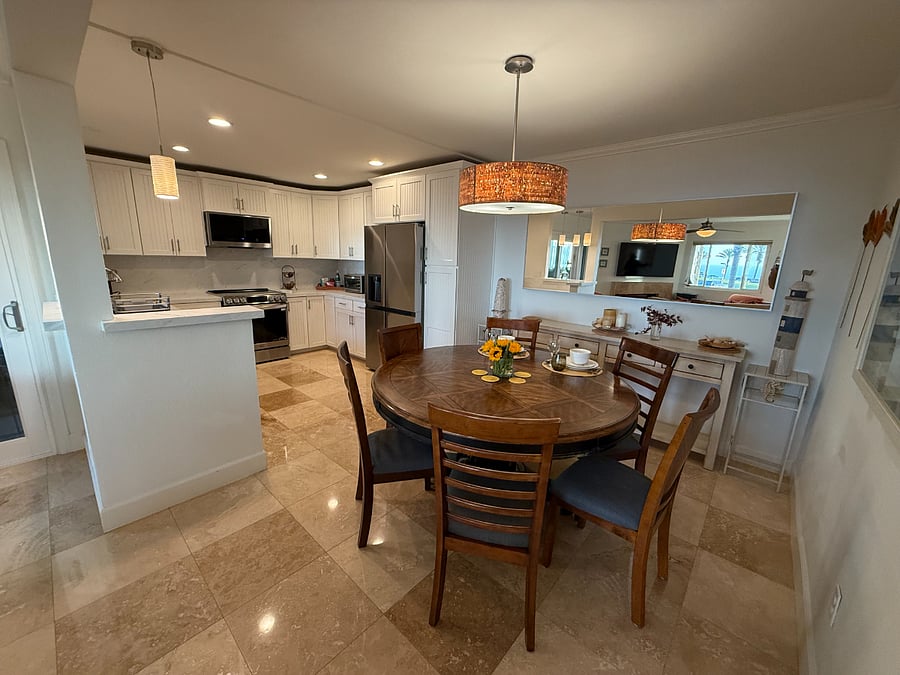 beautiful polished travertine flooring throughout the living, dinning and kitchen area
