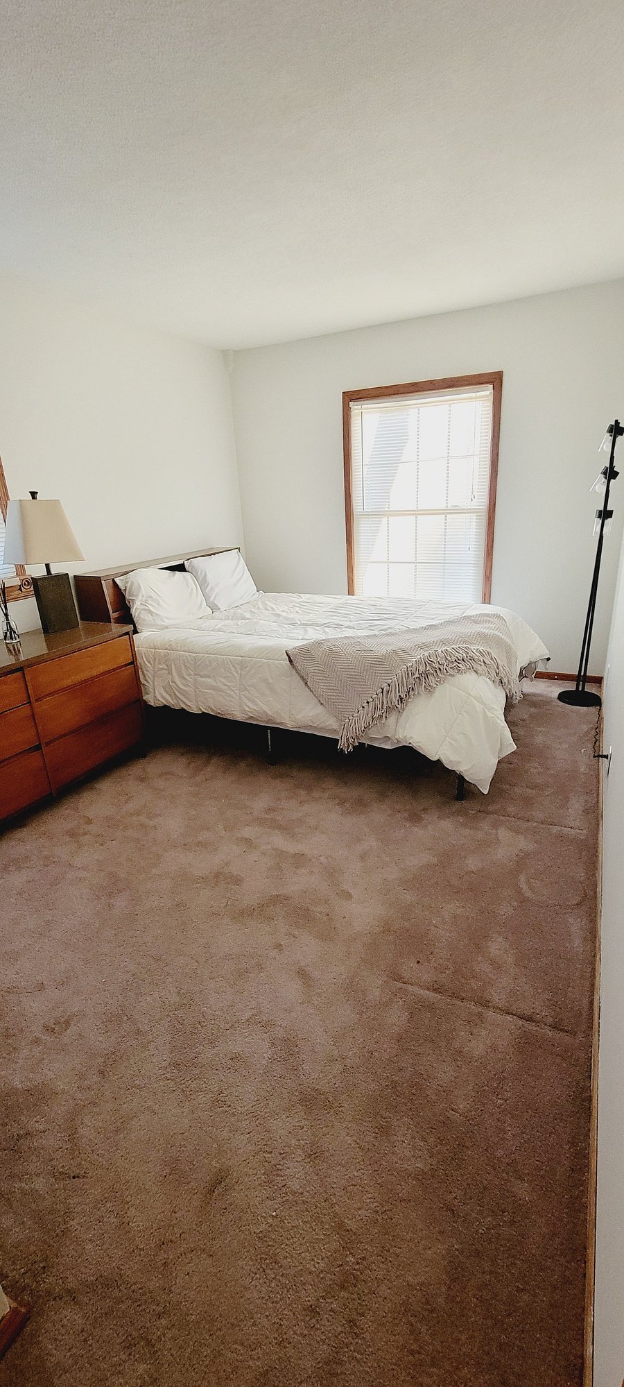 Bedroom #2. Queen size bed, dresser, closet, sitting area, lamp, side tables.