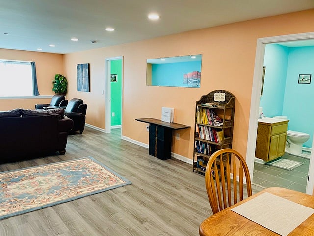 View from kitchen to bedroom, guest bathroom.