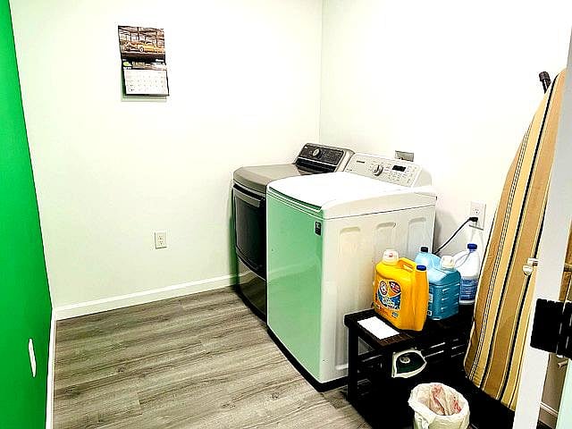 Laundry room with washer and dryer - door can be closed while in use. Supplies including ironing board and iron provided.