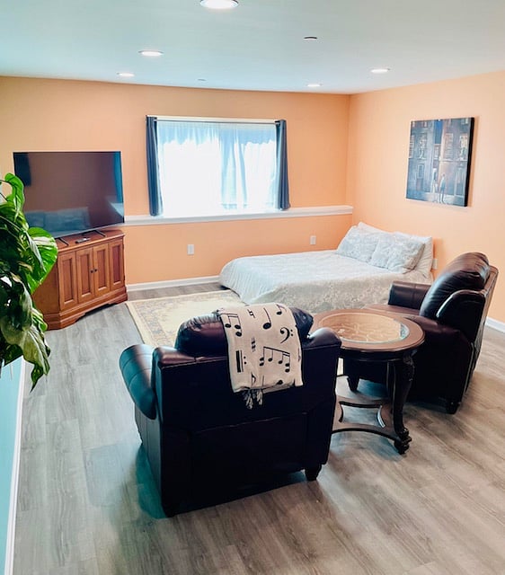 Alternative living room setup with Full-size air mattress for additional sleeping space.