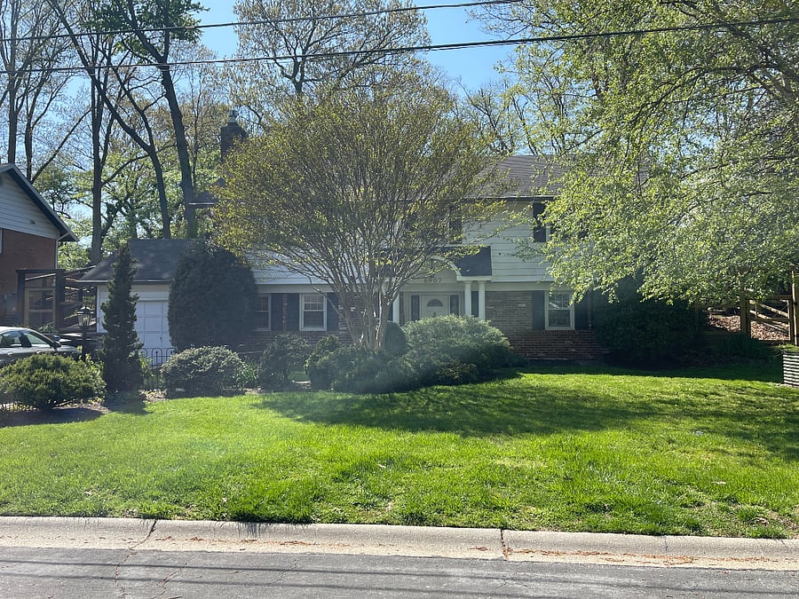 A welcoming front lawn with natural beauty and seasonal bloomssetting the tone for a restful stay.