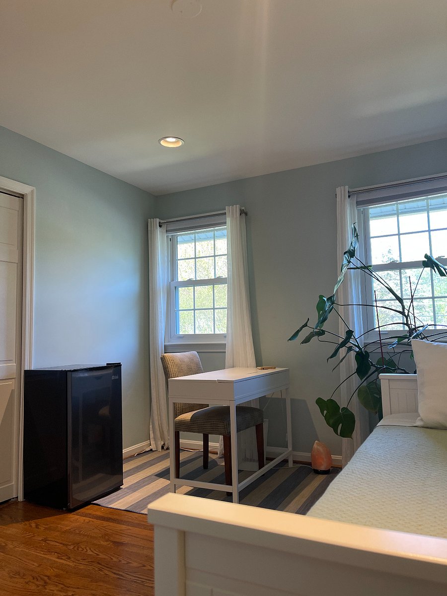 A window-side workspace for writing, reading, or simply enjoying the morning light.