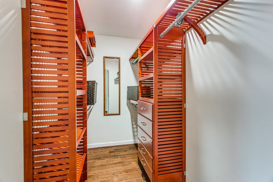 oversized closets, adequate space for hanging and folded clothes