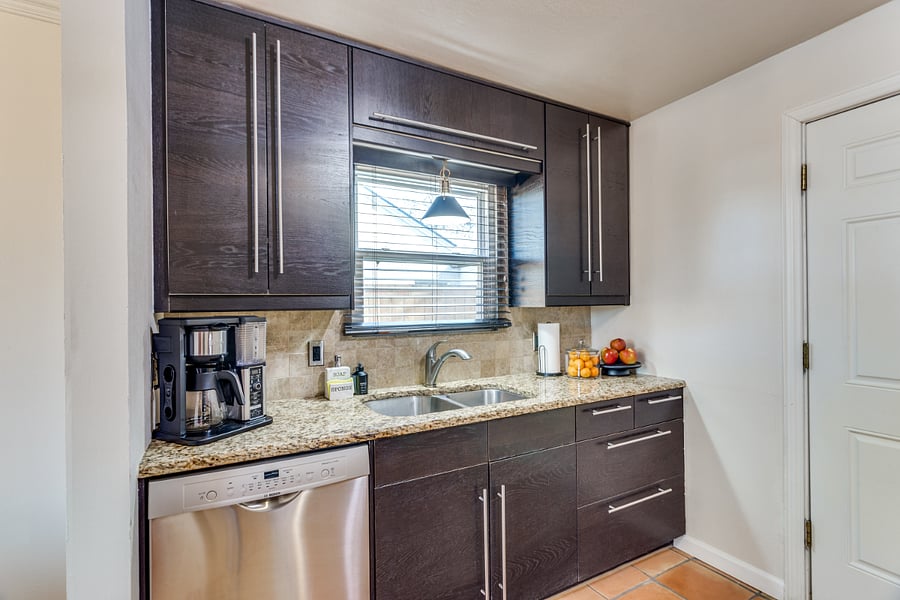 double sinks, coffee pot, espresso and cold brew coffee maker, and large dishwasher