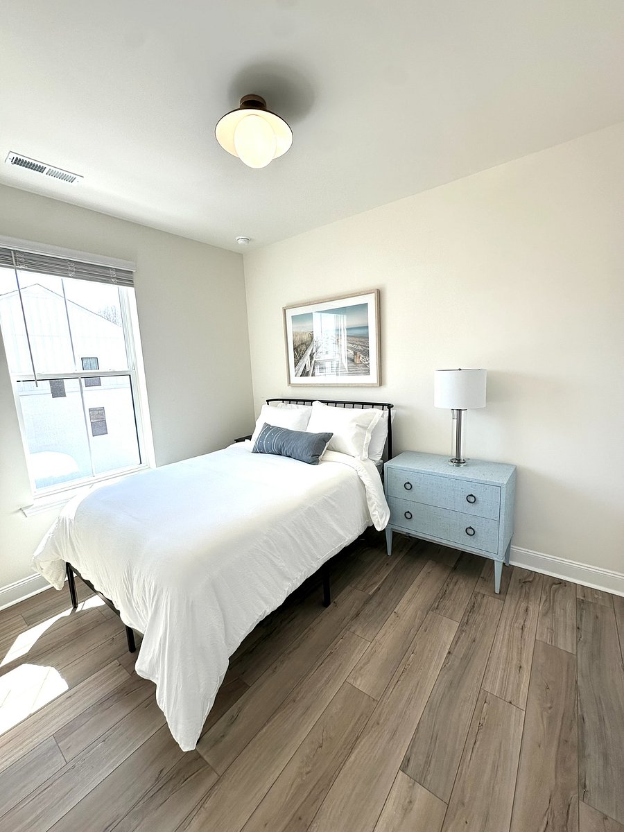Bedroom with full bed and closet on third floor. 