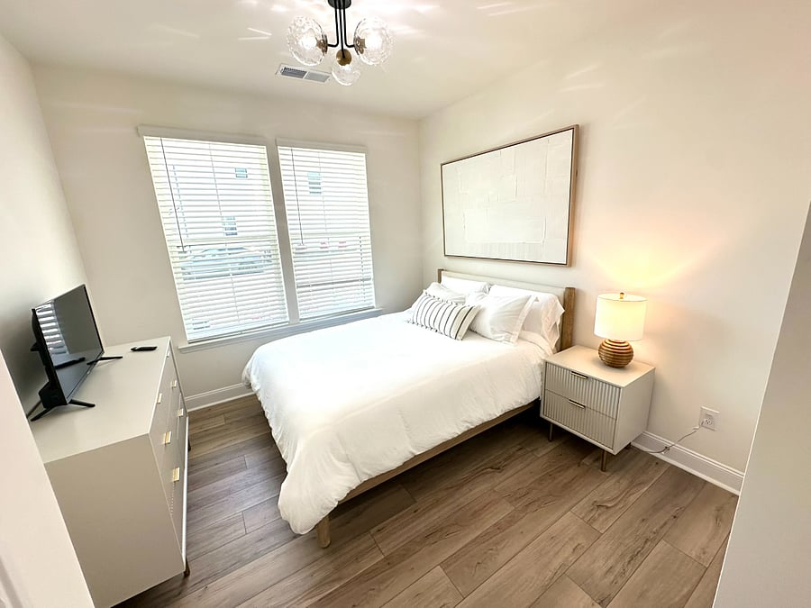 First floor queen bedroom with dresser, nightstand and closet. 