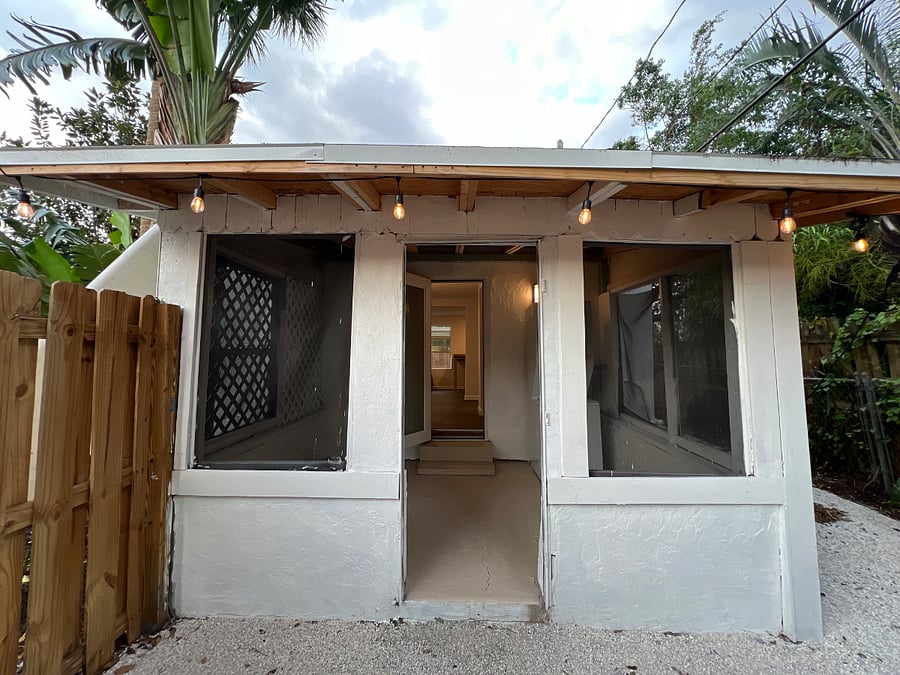 Covered porch offers area to relax outdoors protected from the elements