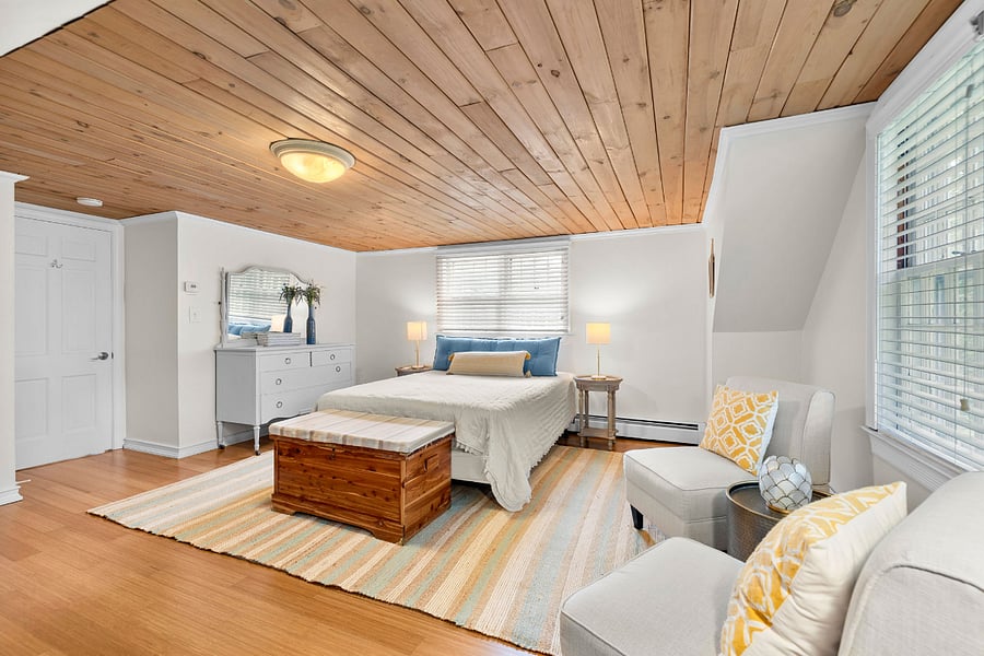 Spacious upstairs queen bedroom.