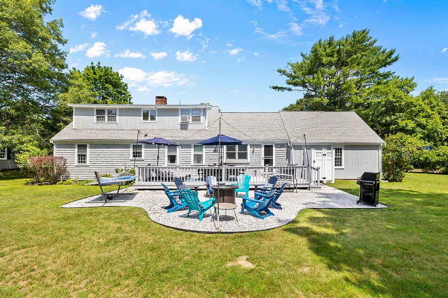 Back view of the house, with large yard.